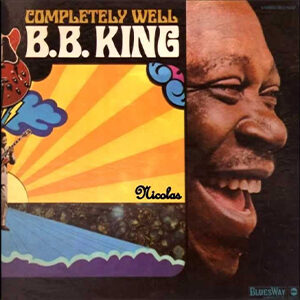 BB King album cover. Image of BB King with an illustration of a sunrise over the ocean